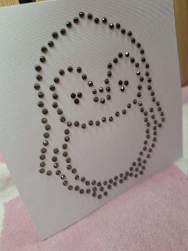 Karte mit strasssteinen Eine gestaltete Karte mit einem glitzernden Pinguin-Motiv.